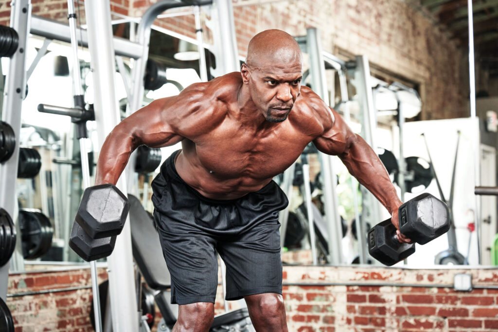 Terry Crews performing Dumbbell flys