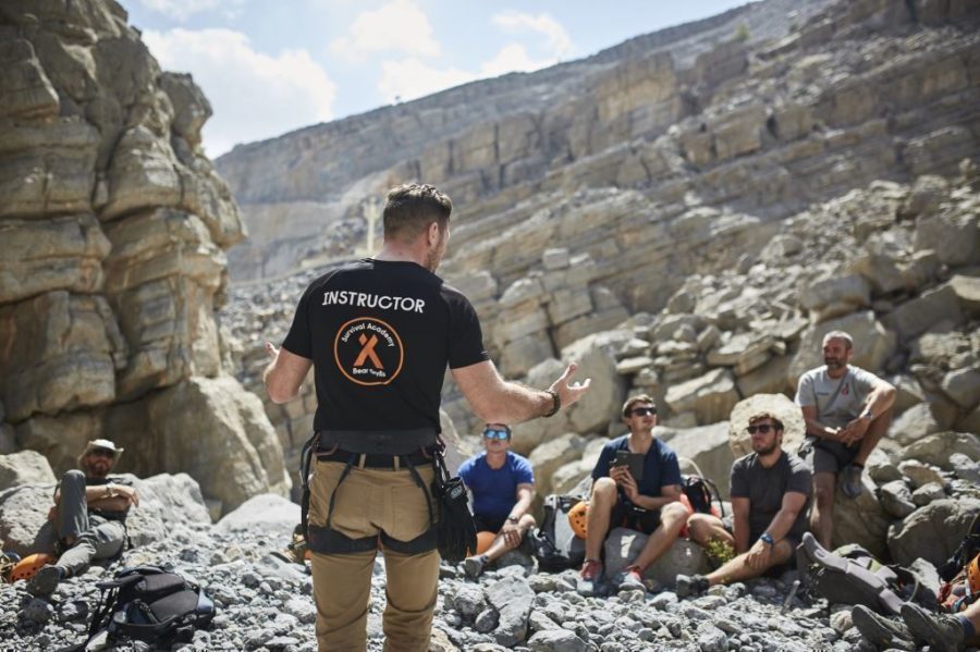 Mountain camp instructor briefs crowd