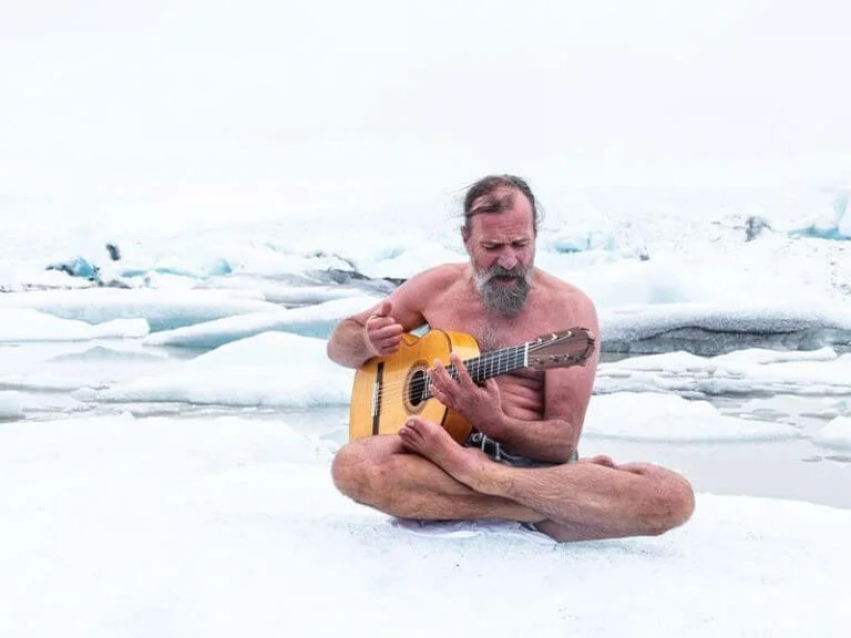 Wim Hof playing guitar in the snow