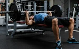 Man doing bench presses for abs