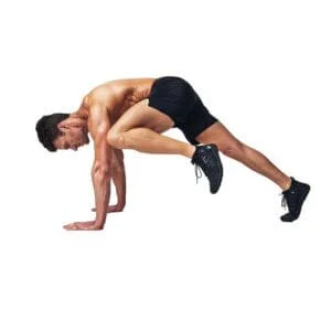 Man doing outside knee tuck slide exercise