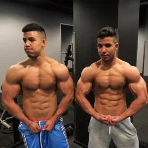 Twin bodybuilders posing with shirts off
