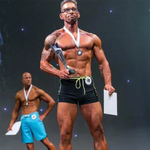 Muscle bound man wins bodybuilding trophey