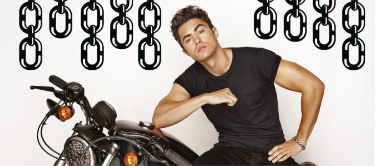 Darren Barnet on a motorcycle