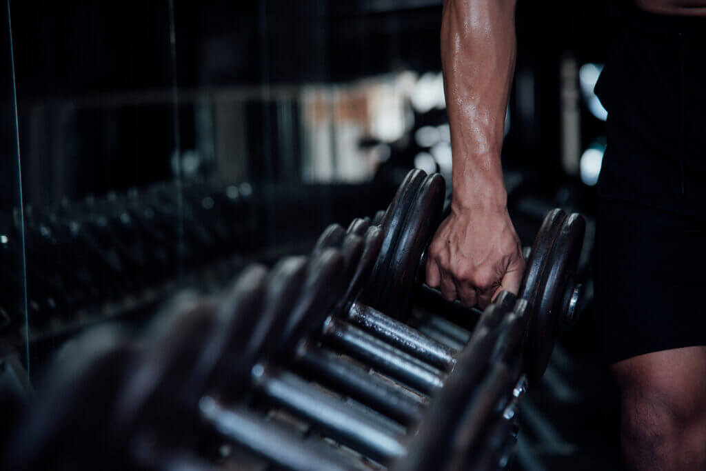 Man acting on his fitness resolution in the gym