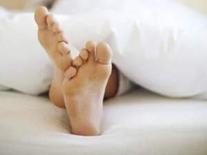 Feet sticking out of duvet