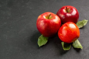 Three red apples