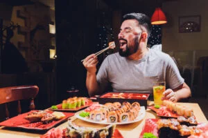 Man eating a large feast
