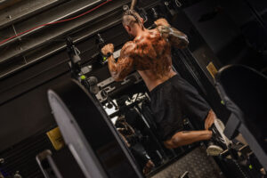 Muscular man doing pull ups