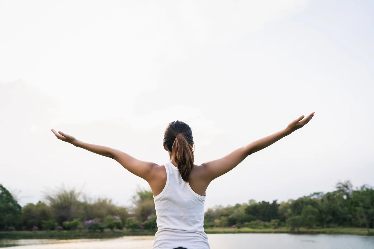 Lady performing arm stretches
