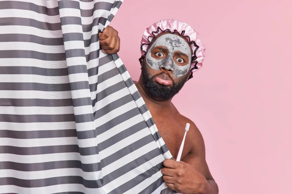 Man showering for personal hygiene