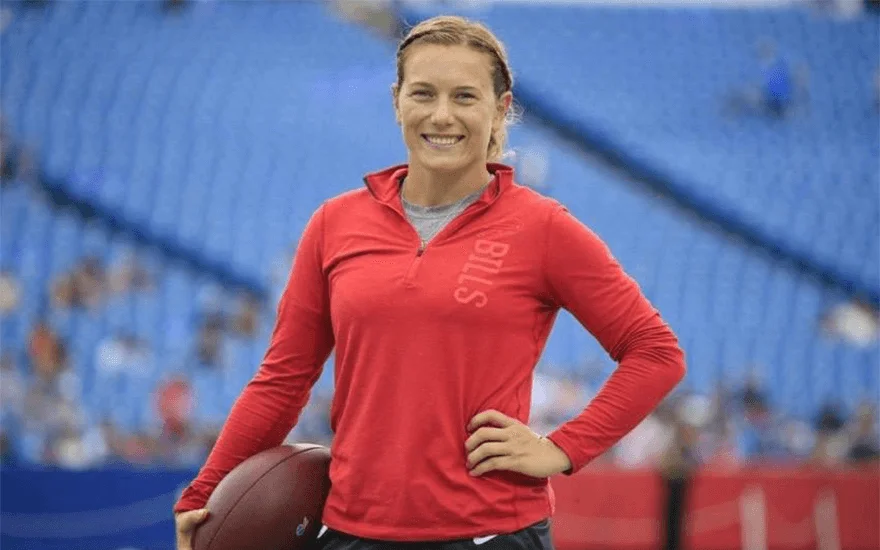 Phoebe Schecter holding an American football