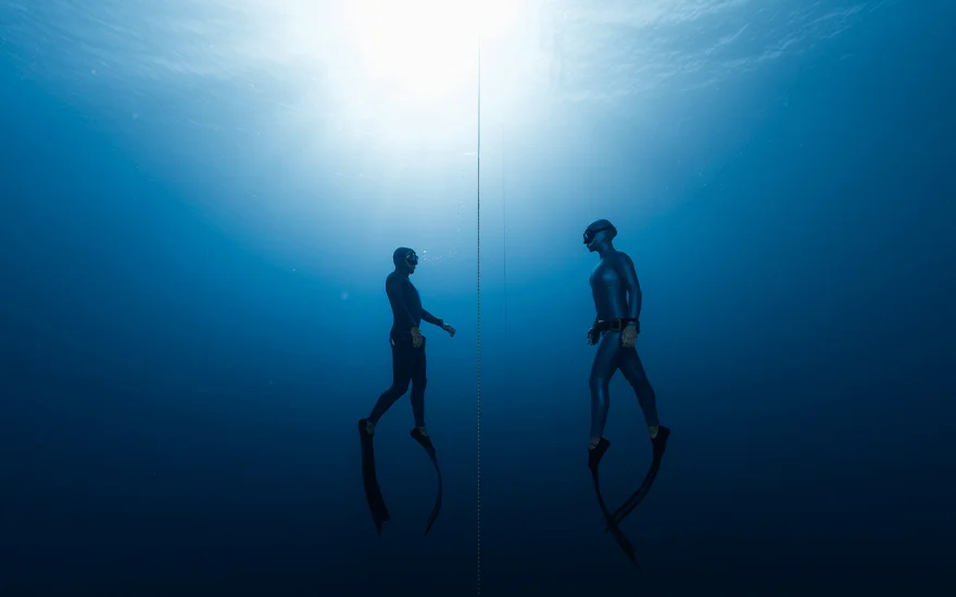 Man and woman freediving
