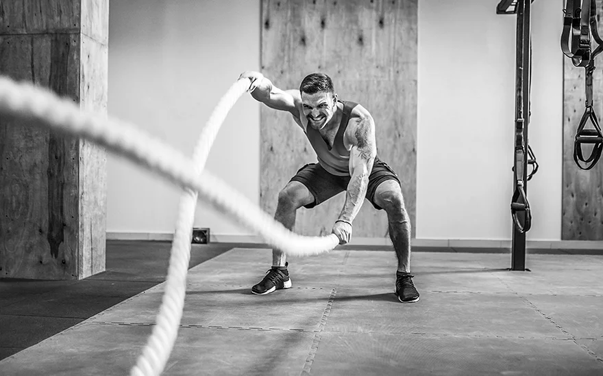 Man working out with ropes