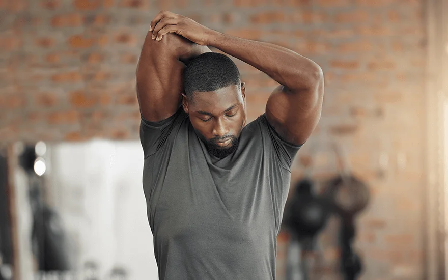 man stretching to aid recovery