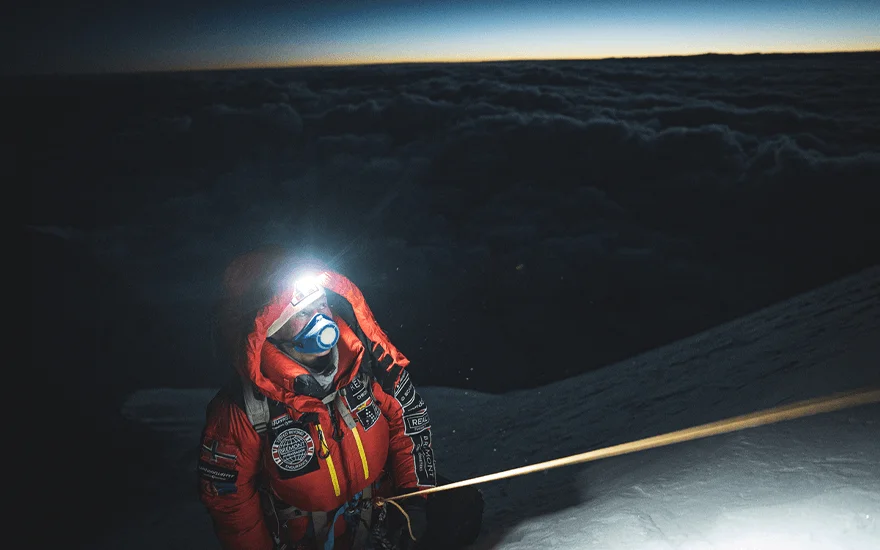 Kristin Harila climbs a mountain at night