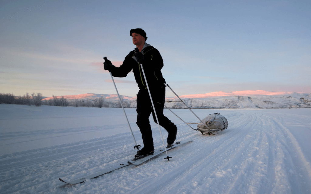 Sam Cox trekking through snow