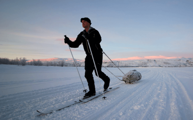 Sam Cox trekking through snow