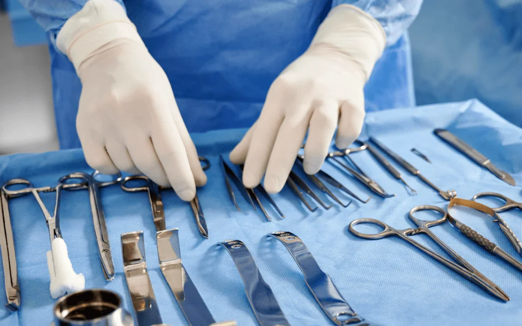 Cosmetic surgeon preparing scalpels