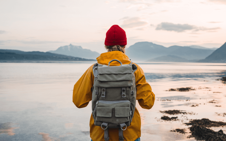Man walking with his travel essentials