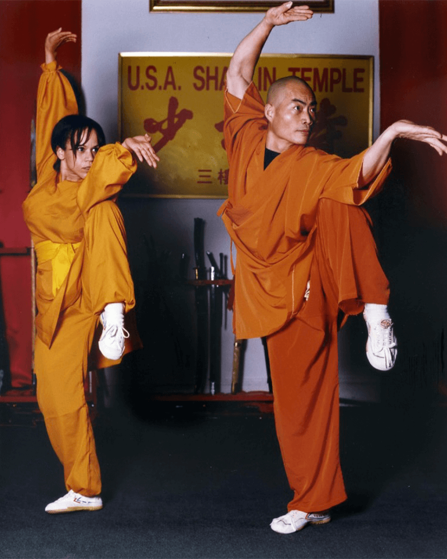 two monks in crane pose