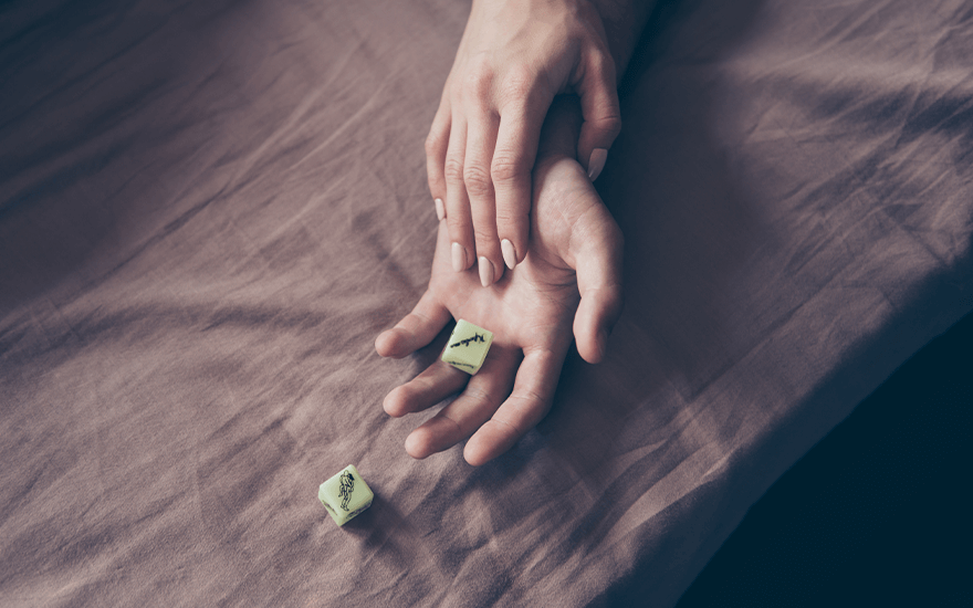 Man and woman roll erotic dice